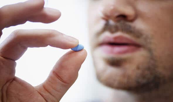 Man takes a blue pill